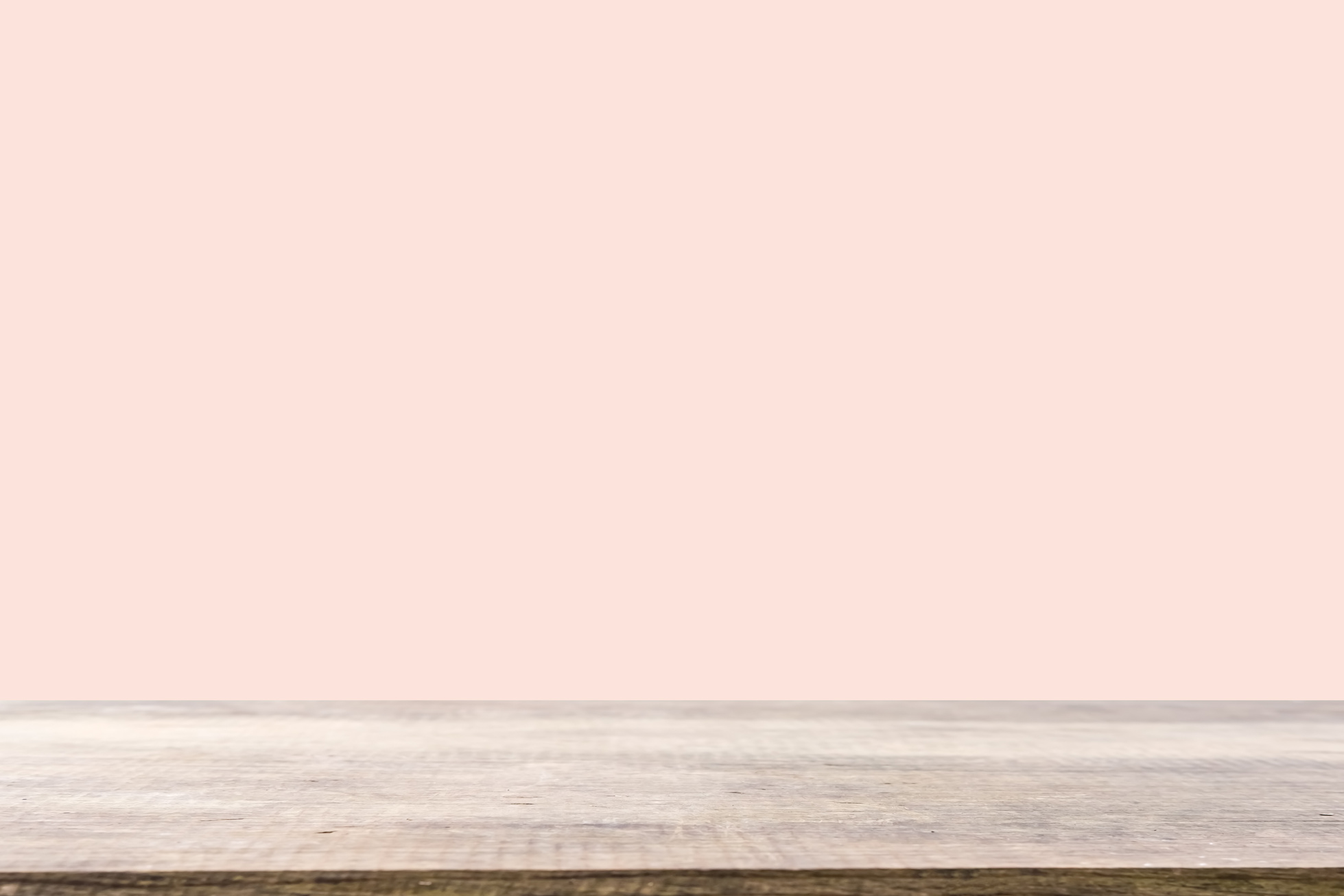 Wooden Table on Peach Background
